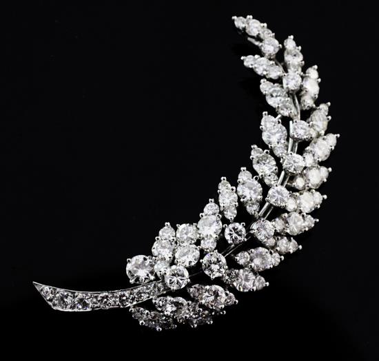 An 18ct white gold and diamond leaf brooch, 2in.